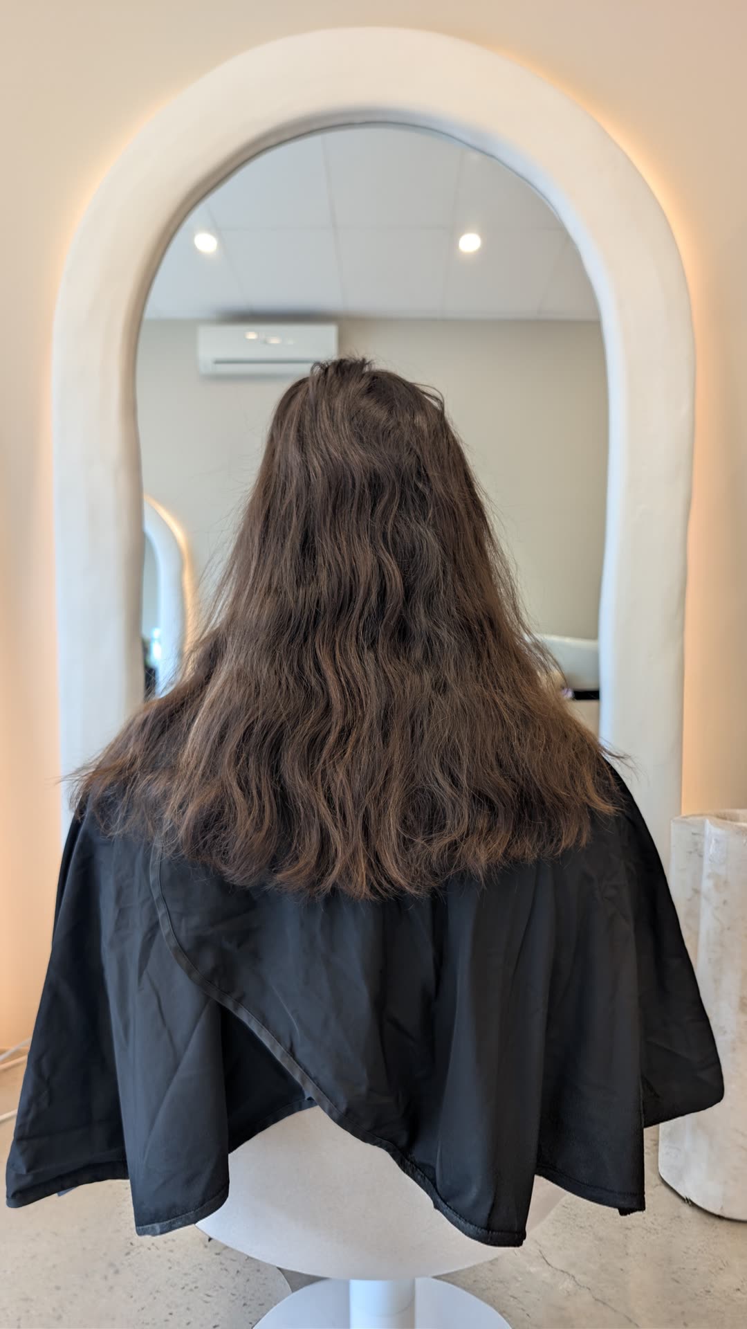 Wavy brown hair before nanoplasty treatment
