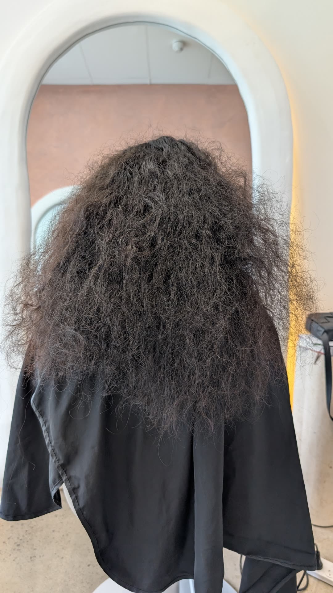 Thick curly hair with volume and frizz before nanoplasty treatment
