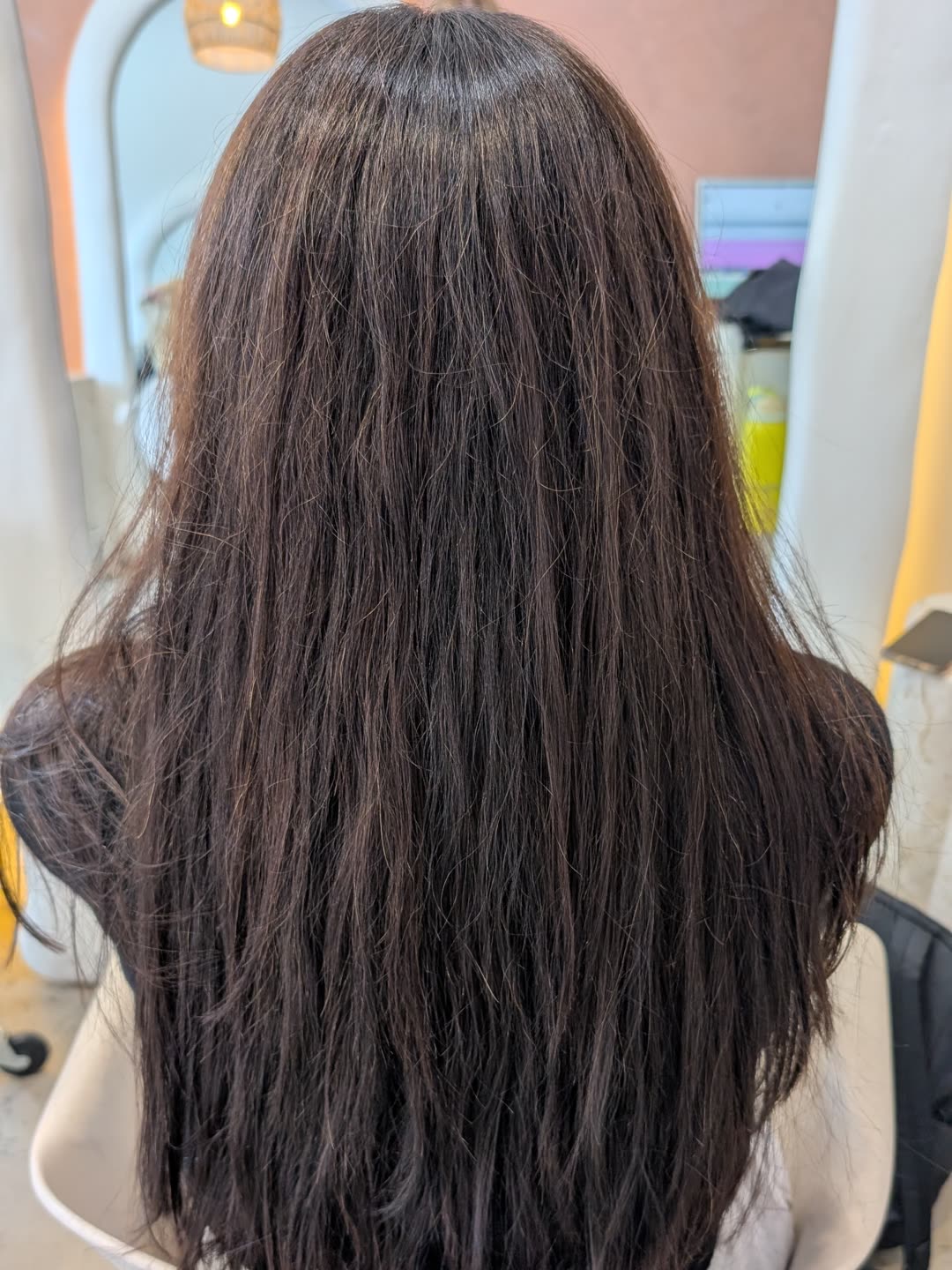 Long hair with natural wave and frizz before any nanoplasty treatment