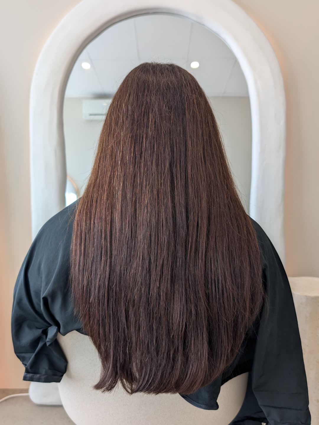 The same client eleven months after her first nanoplasty, hair still smooth