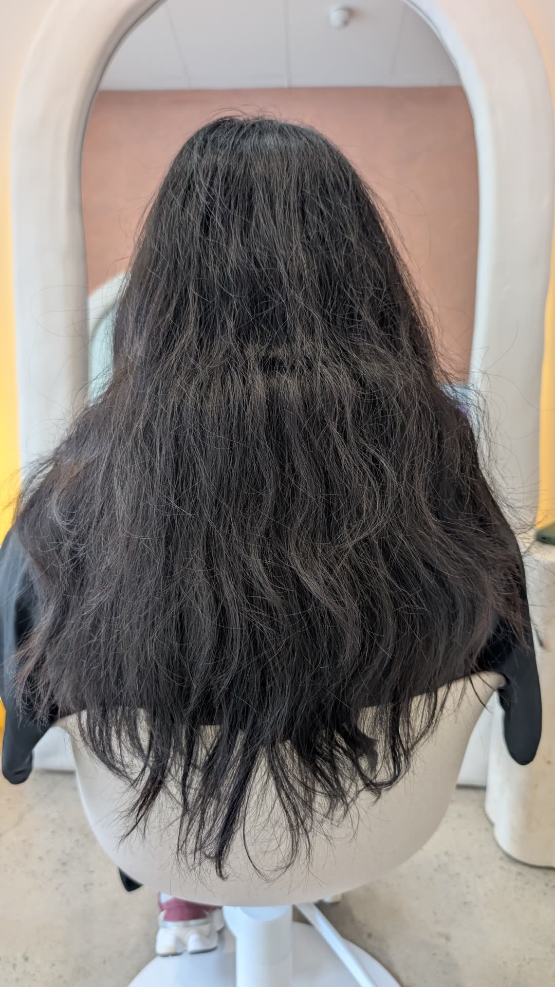 Long black curly hair before nanoplasty treatment